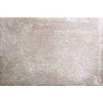Cut out of a large rectangle amber toned stone effect porcelain floor tile