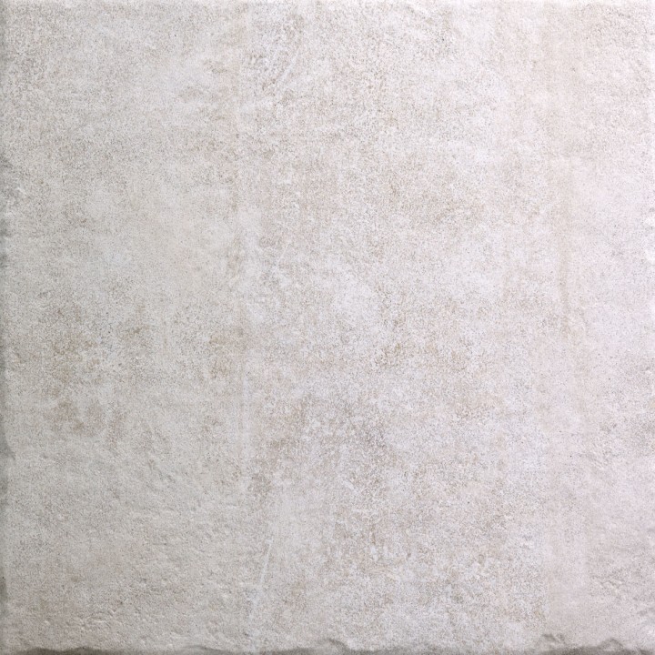 Cut out of large square beige stone effect porcelain floor tile