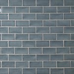 Wall of metro grey blue handmade wall tiles finished with White grout