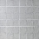Wall of square grey handmade wall tiles finished with White grout, ideal for a bathroom or kitchen