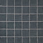 Wall of square dark grey handmade wall tiles finished with White grout, ideal for a bathroom or kitchen