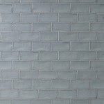 Wall of metro medium grey handmade wall tiles finished with medium grout laid in a brick bond tile pattern