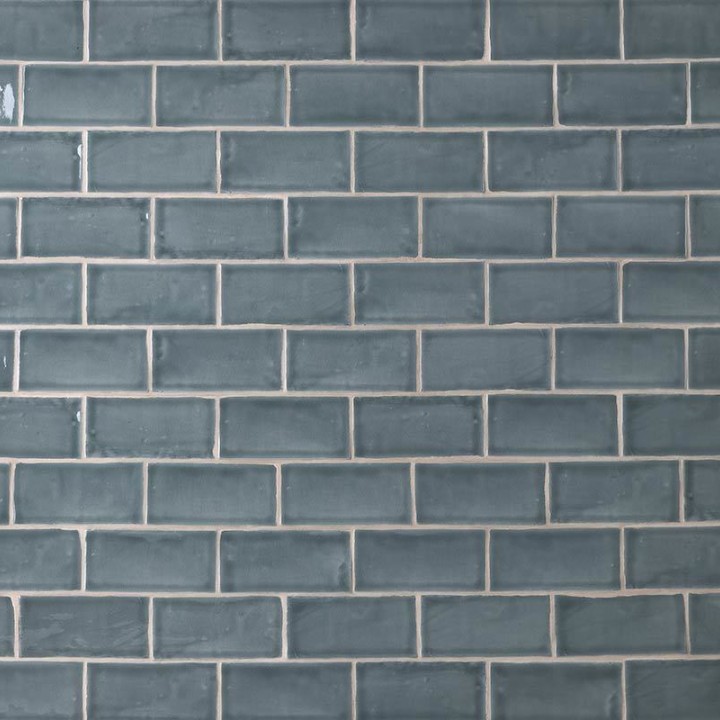 Wall of metro grey blue handmade wall tiles finished with White grout