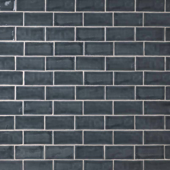 Wall of metro dark grey handmade wall tiles finished with White grout, ideal for a bathroom or kitchen
