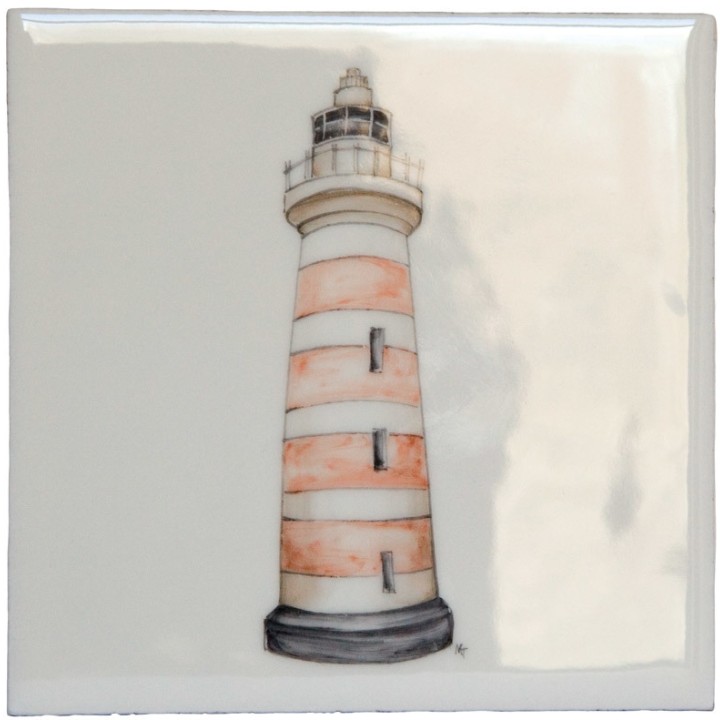 A cut out of an antique white square tile with lighthouse illustration