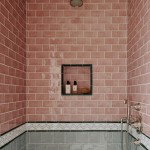 pink coloured Seasons Heather Bank handmade wall tiles used in a shower area above square grey wall tiles.