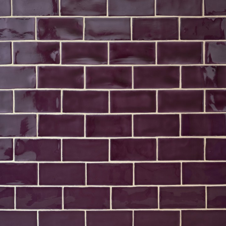 Wall of gloss plum purple medium metro tile laid in a brick bond tile pattern