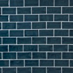 Wall of a deep navy medium brick metro tiles with white grout laid in a brick bond tile pattern