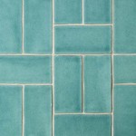 Close up of 14 aqua green medium brick metro tiles with beige grout