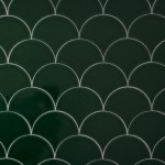 Wall of emerald green scallop tiles with jasmine grout laid in a fish scale pattern ideal for kitchens and bathrooms