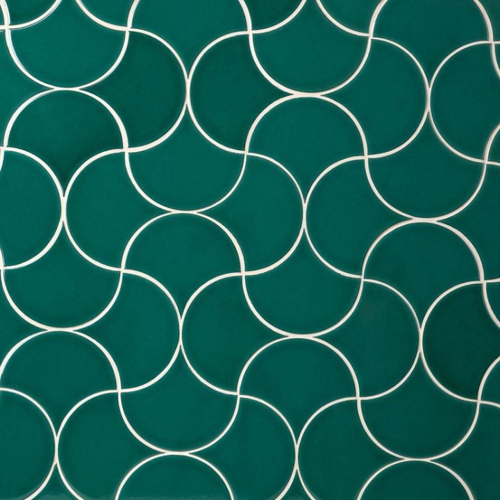 Wall of bottle green scallop tiles with white grout laid in a fish scale pattern ideal for kitchens and bathrooms