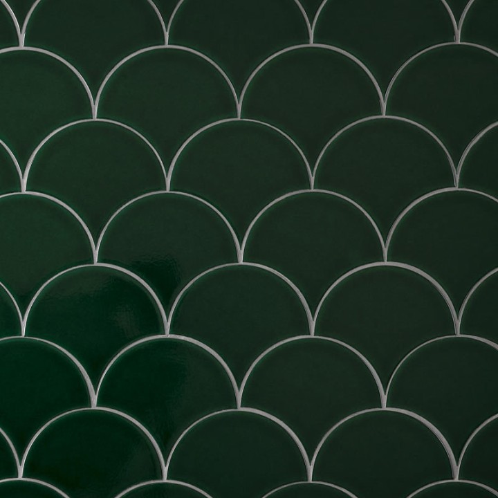 Wall of emerald green scallop tiles with jasmine grout laid in a fish scale pattern ideal for kitchens and bathrooms