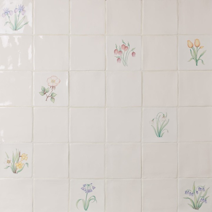 Wall of spring flower square tiles featuring hand painted bulbs like daffodils, tulips and snowdrops