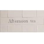 Cut out of three word tiles with 'afternoon tea' handpainted on them