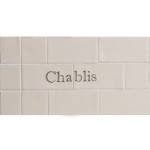 Cut out of two word metro tiles with the word 'Chablis' hand painted on them