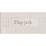 Cut out of two word metro tiles with the word 'Flapjack' hand painted on them