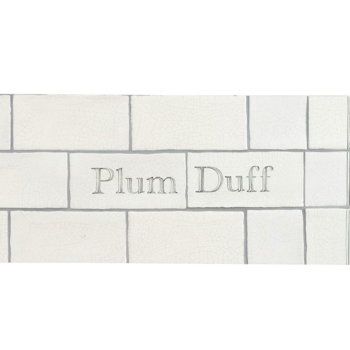 Cut out of two word metro tiles with the word 'Plum Duff' hand painted on them