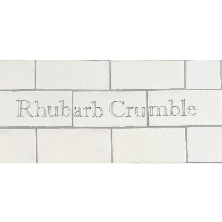 Cut out of Three word metro tiles with the words 'Rhubarb Crumble' hand painted on them