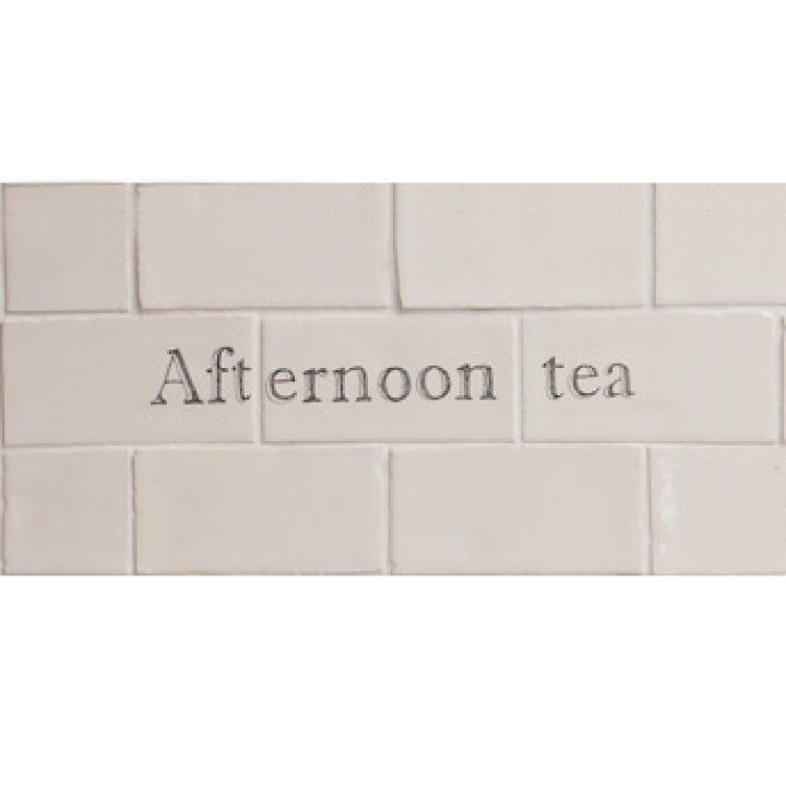 Cut out of three word tiles with 'afternoon tea' handpainted on them