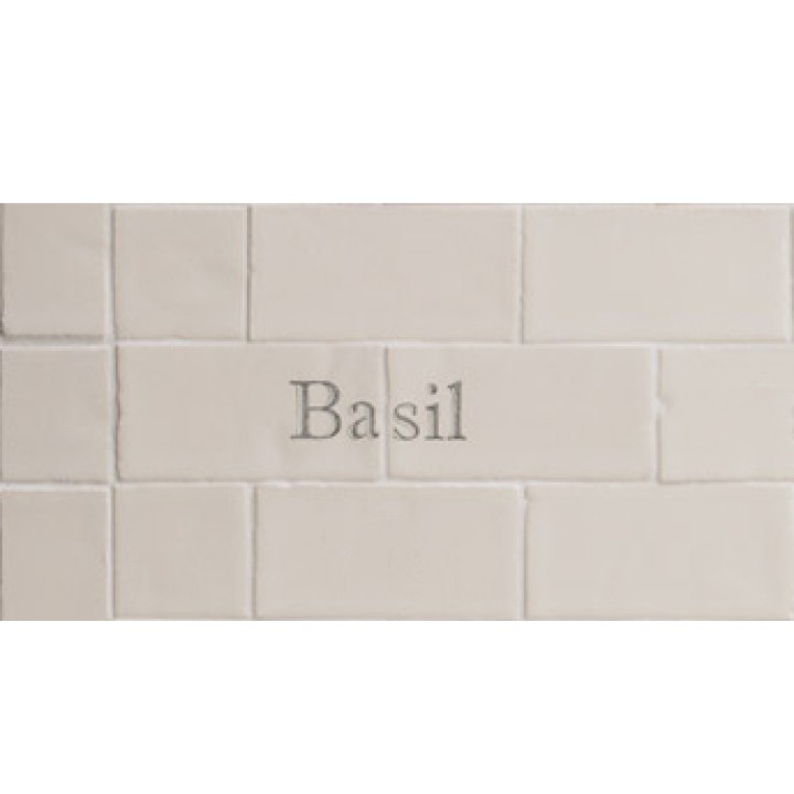 Cut out of two word metro tiles with the word 'Basil' hand painted on them