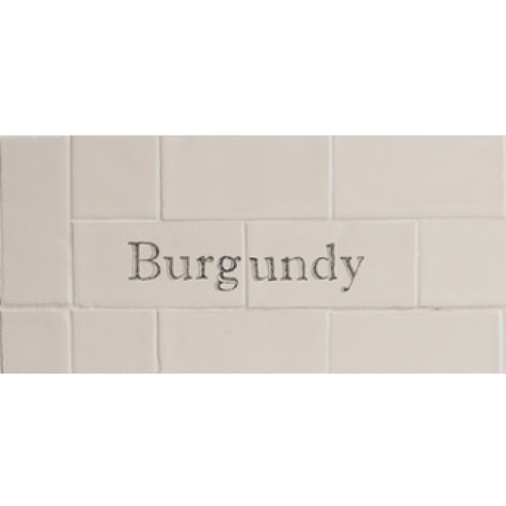 Cut out of two word metro tiles with the word 'Burgundy' hand painted on them