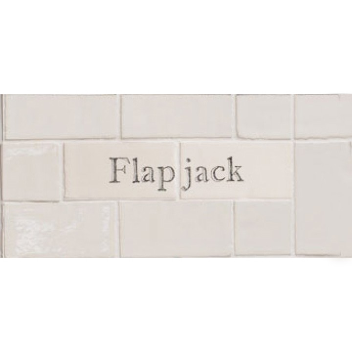 Cut out of two word metro tiles with the word 'Flapjack' hand painted on them