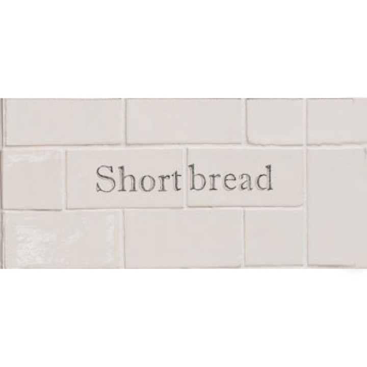 Cut out of two word metro tiles with the words 'shortbread' handpainted on them