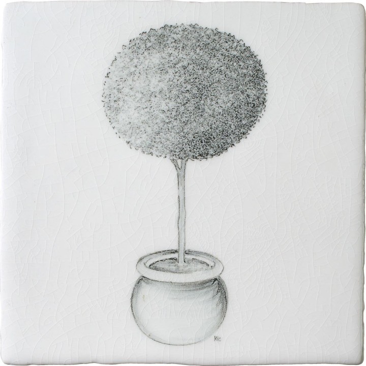 A cut out of an antique white square tile with topiary illustration in a charcoal style