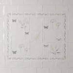 Tiled splashback with a compilation of wild grasses and butterflies with ornate borders