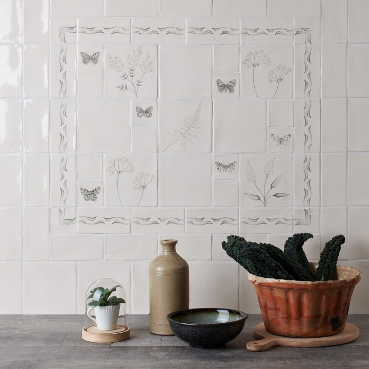 Tiled splashback with a compilation of wild grasses and butterflies with ornate borders