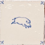 Cut out image of white tile with handpainted delft pig illustration and ornate corners