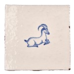 Cut out image of white tile with handpainted delft blue ibex illustration