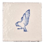 Cut out image of white tile with handpainted delft blue owl illustration