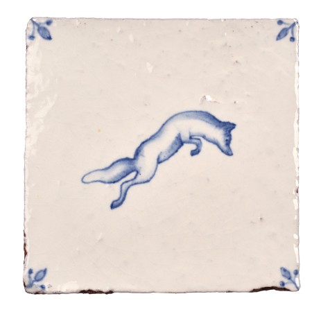 Cut out image of white tile with handpainted delft fox illustration and ornate corners
