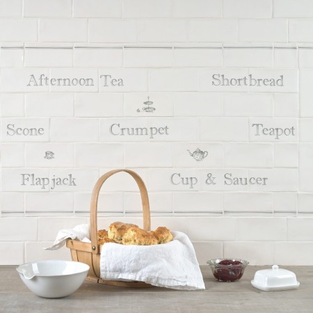 Word tile panel with charcoal border tiles with names of afternoon tea snacks and illustrations