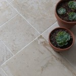 Floor of york stone effect porcelain floor tile mix of sizes with white grout