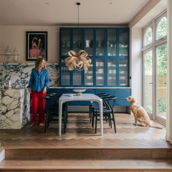 Tara Jenkins in kitchen with dog square crop