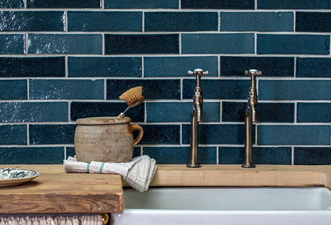 Deep blue zellige and bejmat effect wall tiles in a kitchen
