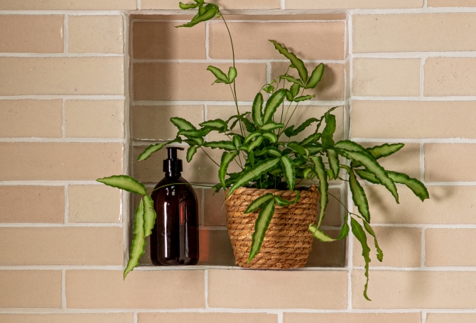 Neutral zellige and bejmat effect wall tiles in a beautiful shower