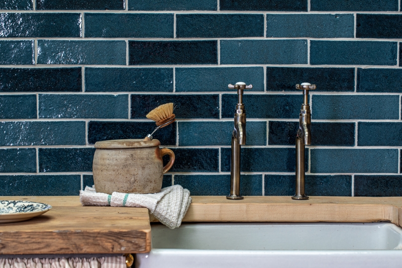 Deep blue zellige and bejmat effect wall tiles in a kitchen