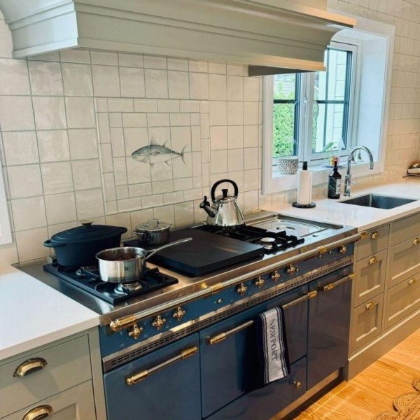Bespoke Tuna fish panel behind a range cooker in a home in Norway