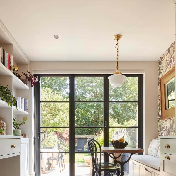 White bistro kitchen looking out onto a garden