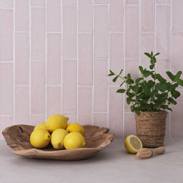 A handmade, rustic, delicate blossom pink skinny metro tile.