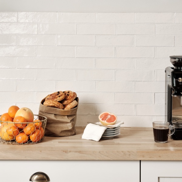 Skinny brick metro wall tiles from our Kennet collection in warm white Winterbourne, with matching white grout.