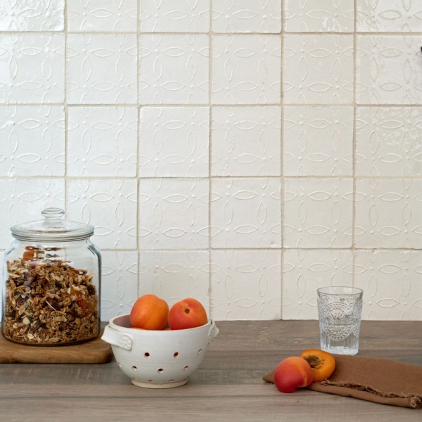 Valley, f﻿rom our Ullswater collection, is a square tile in antique white. Available in your choice of three vintage-inspired hand piped relief designs, including Margot - the floral motif shown here, and as a plain tile.